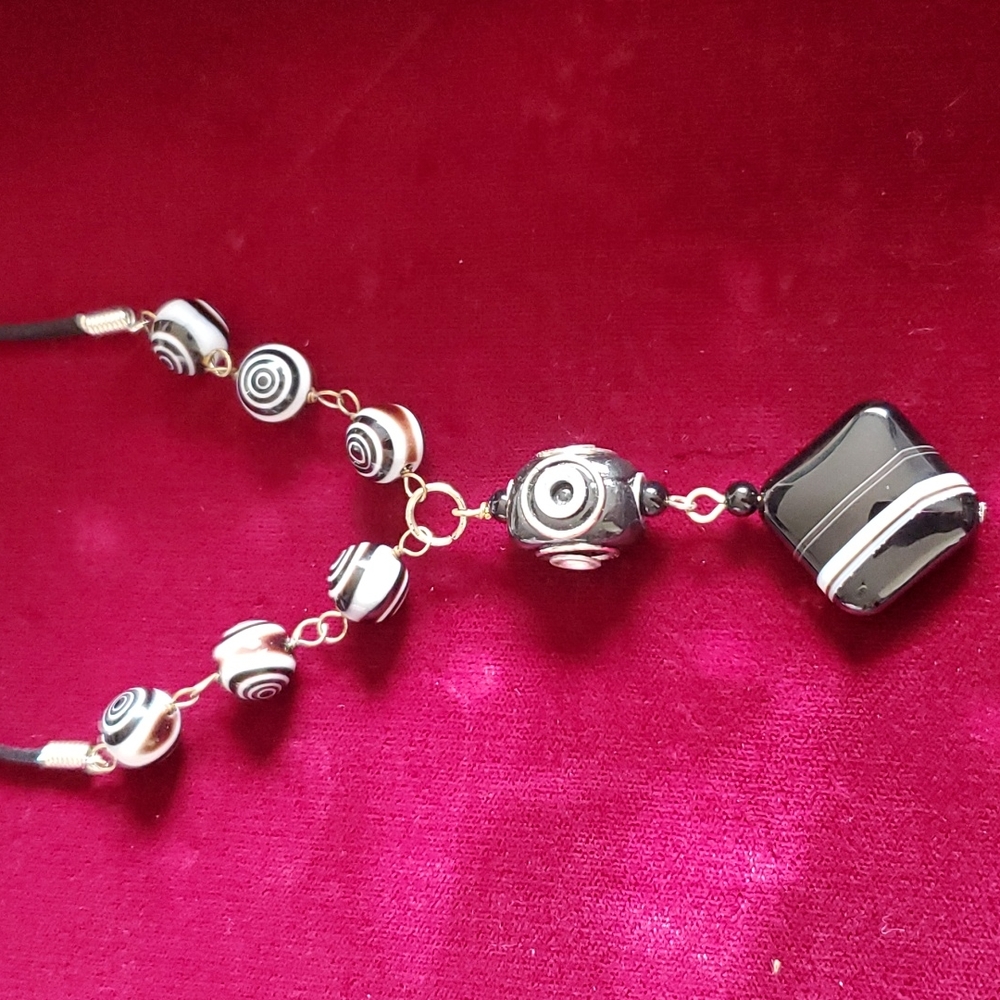one-of-a-Kind hand-made glass necklace.